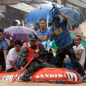 Death toll from a tropical storm in Philippines rises to 13, 9 missing